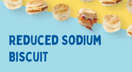 Reduced Sodium Biscuit Litho. Biscuits, Sausage, Egg & Cheese Biscuit Sandwiches, and Fried Chicken Biscuit Sandwiches with Coleslaw lined up in a diagonal line on a light blue and yellow background.